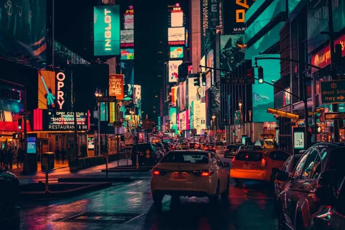 Times Square at night near best Midtown Manhattan hotels